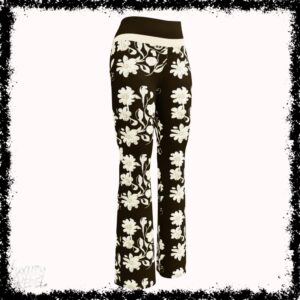 Flare leggings featuring a black base with an elegant cream floral pattern, named Elegance Unveiled Flare Leggings, part of the Luxury Rebel collection.