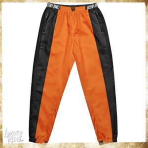 Joggers featuring a bold design with vibrant autumn orange and black color blocks, named Luxury Rebel Autumn Orange & Black Joggers, part of the Luxury Rebel collection.