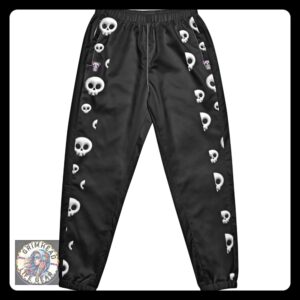 Black joggers featuring a pattern of white skulls cascading down the sides, named Rebel Grim Skull Parade Joggers, part of Grimhead Life Gear.