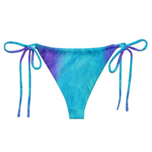 These teal-and-purple tie-dye string bikini bottoms feature side ties for an adjustable fit, inspired by a playful monster theme.