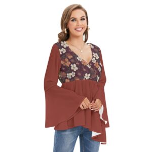 A flowy boho blouse from the Blooming Ember Collection with bell sleeves, a maroon floral print bodice, and an asymmetrical hem for a modern, flattering style.