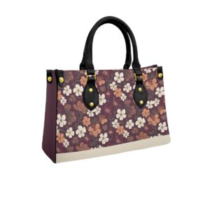 Handbag from the Blooming Ember collection featuring a floral design in warm plum and earthy tones. Durable and spacious for all-day wear.