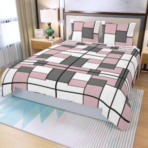 A 3-piece duvet set featuring a geometric block design in pink, white, black, and gray. The set includes a duvet cover and two matching pillowcases, offering a bold and modern update to any bedroom decor.