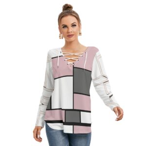 A long-sleeve top with a geometric block design in pink, white, black, and gray. The top features a lace-up neckline detail and a relaxed fit, combining modern chic with stylish comfort for a standout casual look.