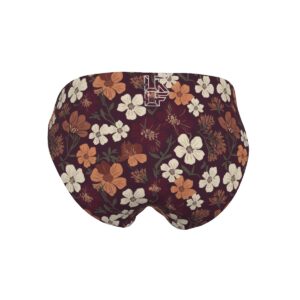 A close-up of women’s floral underwear from the Blooming Ember collection, showcasing a vibrant mix of warm-toned florals against a deep plum background. Designed for all-day comfort with a breathable fabric and soft elastic waistband, this underwear combines function with elegance.