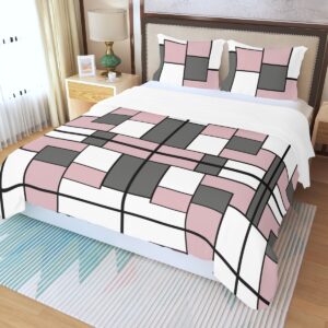 A 3-piece duvet set featuring a geometric block design in pink, white, black, and gray. The set includes a duvet cover and two matching pillowcases, offering a bold and modern update to any bedroom decor.