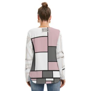 A long-sleeve top with a geometric block design in pink, white, black, and gray. The top features a lace-up neckline detail and a relaxed fit, combining modern chic with stylish comfort for a standout casual look.