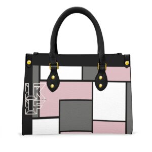 A stylish tote bag featuring a geometric block design in pink, white, black, and gray. The bag has sturdy black handles, gold-tone accents, and a spacious interior, making it perfect for daily use while adding a chic and modern flair.