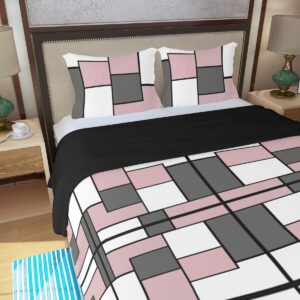 A 3-piece duvet set featuring a geometric block design in pink, white, black, and gray. The set includes a duvet cover and two matching pillowcases, offering a bold and modern update to any bedroom decor.