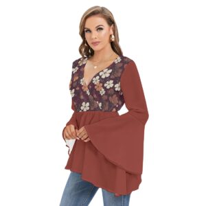 A flowy boho blouse from the Blooming Ember Collection with bell sleeves, a maroon floral print bodice, and an asymmetrical hem for a modern, flattering style.