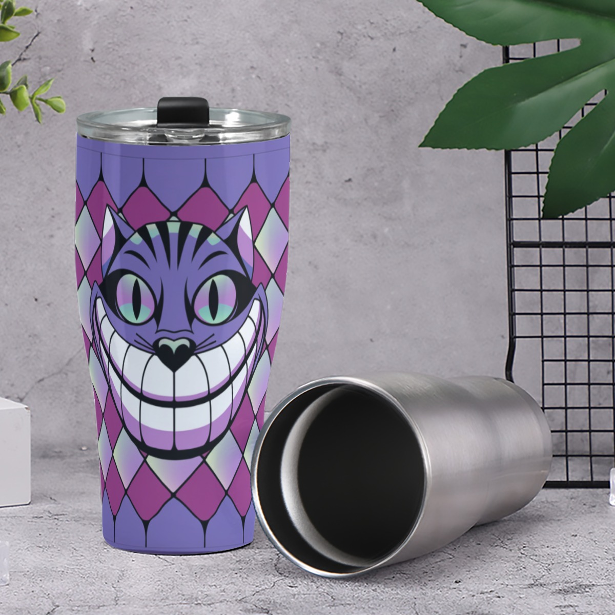 Add a dash of whimsy to your day with the Cheshire Grin Tumbler!
