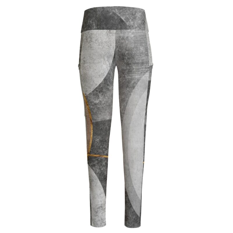 The Monochrome Elegance Leggings bring art to your athleisure with their modern abstract design in gray tones, highlighted by delicate gold details. Designed with a high-waisted fit, they provide support and style for both active and relaxed days.