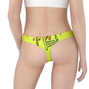 Neon yellow thong featuring a psychedelic, melting smiley face with bold black text that reads "Keep On Shrooming, Mellow Out" for a fun, trippy vibe.