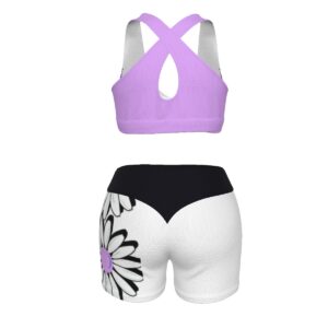 A dynamic sports bra and shorts set featuring purple butterflies and white daisies with black outlines, designed for active comfort and bold style.