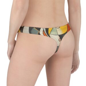 Thong with bold geometric cubist patterns in shades of yellow, orange, black, and muted green, creating an abstract, artistic aesthetic.