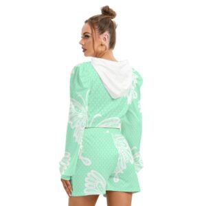 A mint green fleece hoodie and shorts set featuring a large white butterfly graphic. The hoodie is cropped with long sleeves and a drawstring hood, while the matching shorts have an elastic waistband and a relaxed fit. The model wears the set with confidence and a top knot hairstyle.