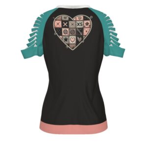 A women’s short-sleeve t-shirt with teal slashed sleeves and a light pink hem. The center graphic shows a stitched-up, gothic unicorn with multicolored hair, button eyes, and a stitched belly, holding up both middle fingers. Above it, the text reads “Cursed With” and below it says “Not Today, Rainbow Demons.” The background is black with small skull and star accents.
