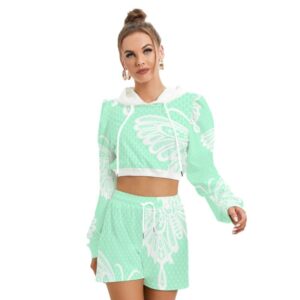 A mint green fleece hoodie and shorts set featuring a large white butterfly graphic. The hoodie is cropped with long sleeves and a drawstring hood, while the matching shorts have an elastic waistband and a relaxed fit. The model wears the set with confidence and a top knot hairstyle.