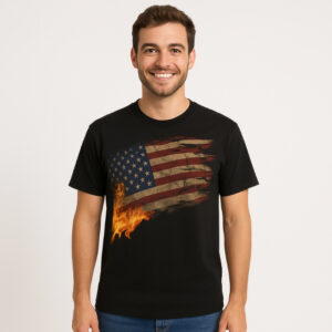 A black t-shirt with a distressed American flag printed across the front. Flames rise from the lower left corner of the flag, creating a visual of fire and endurance. The design represents strength, sacrifice, and national pride.
