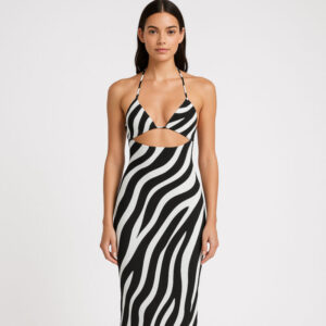 A cream and charcoal abstract zebra-patterned halter dress with a cutout back and midi length.