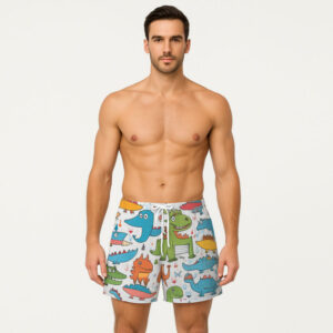 White men’s swim shorts featuring a colorful cartoon dinosaur pattern with various goofy expressions and party hats.