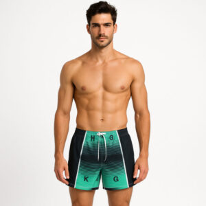 Men’s swim shorts with a modern green and black striped digital design and random letters printed across the front.