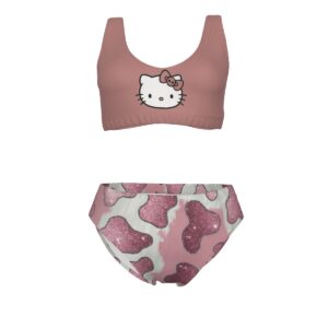 A matching two-piece set featuring a pink sports bra with a centered Hello Kitty face graphic, paired with high-waisted bikini bottoms in a pink glitter cowprint pattern. The set blends athletic and playful kawaii fashion.