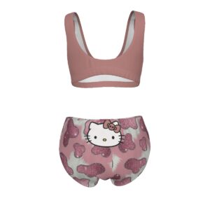 A matching two-piece set featuring a pink sports bra with a centered Hello Kitty face graphic, paired with high-waisted bikini bottoms in a pink glitter cowprint pattern. The set blends athletic and playful kawaii fashion.